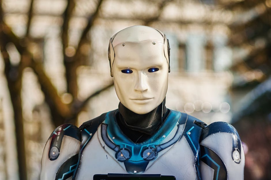 Close-up of a humanoid robot with a futuristic design posing outdoors.